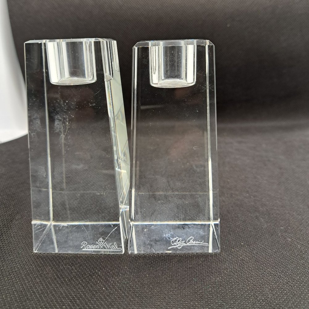 One Oleg Cassini and One Rosenthal crystal candle holders.
